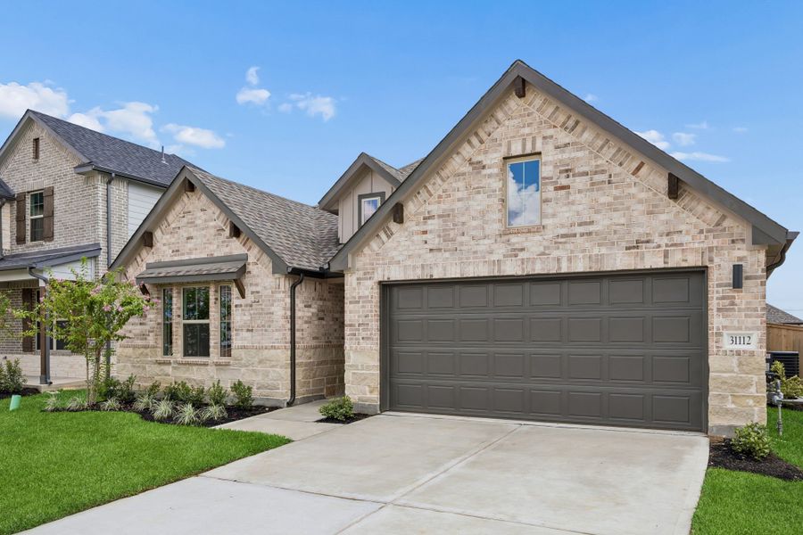 Front exterior of a new home in Riviera Pines, Huffman, TX, highlighting curb appeal (Image 20).