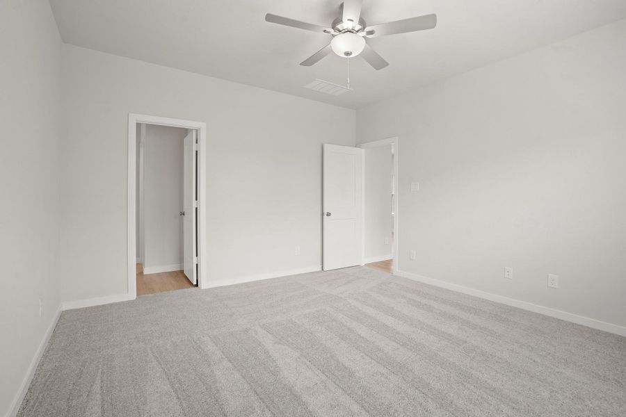 Spacious, unfurnished interior of a new home in Sunterra, Katy (Image 22).