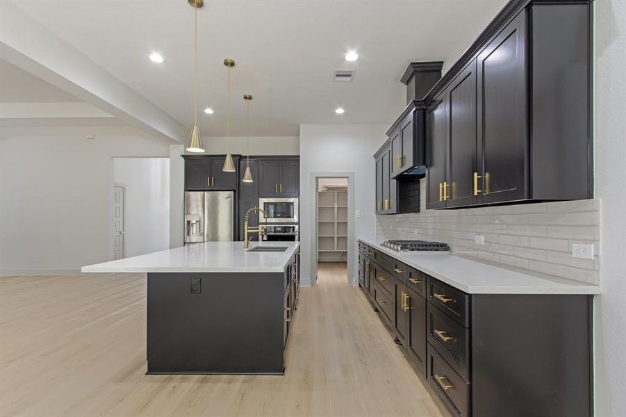 The kitchen island offers ample space for a breakfast seating area.