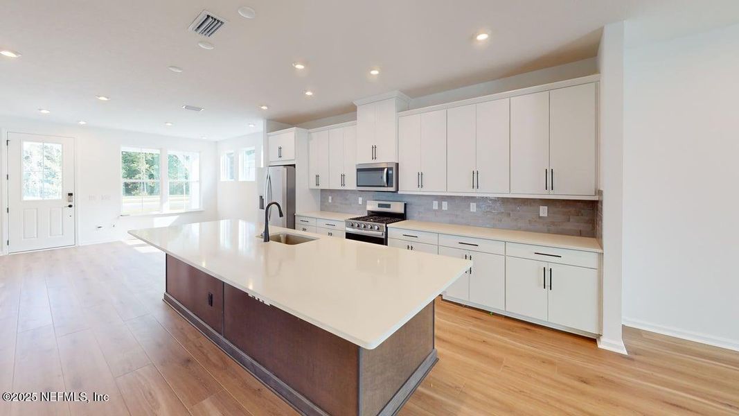 Furnished interior view inside a new home in RiverTown - WaterSong, St. Johns (Image 8).