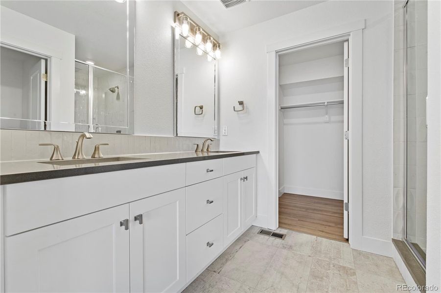 Primary suite with ensuite bath with two sinks