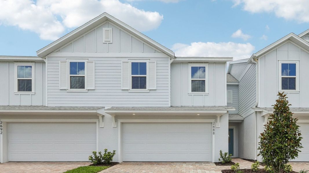 Front exterior of a new home in Cyrene at Harmony, St. Cloud, FL, highlighting curb appeal (Image 19).
