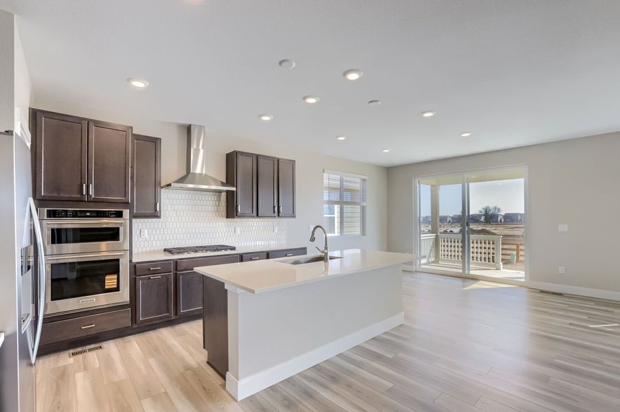 Furnished interior view inside a new home in Barefoot, Firestone (Image 3).