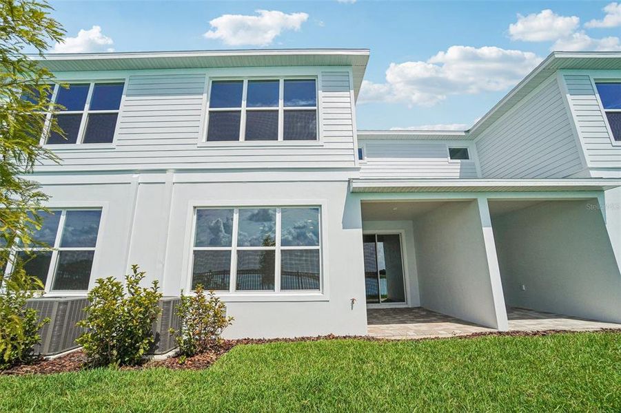 Front exterior of a new home in Isla Mirada, San Antonio, FL, highlighting curb appeal (Image 2).