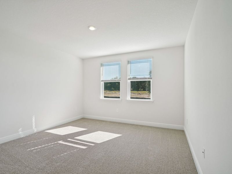 Spacious, unfurnished interior of a new home in The Reserve at Hammock Oaks - Signature Series, Lady Lake (Image 13).