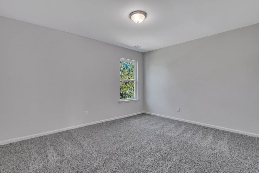 Representative unfurnished interior of a home built from the The Hatteras by Smith Family Homes in Ramsey Landing, Rincon (Image 28).