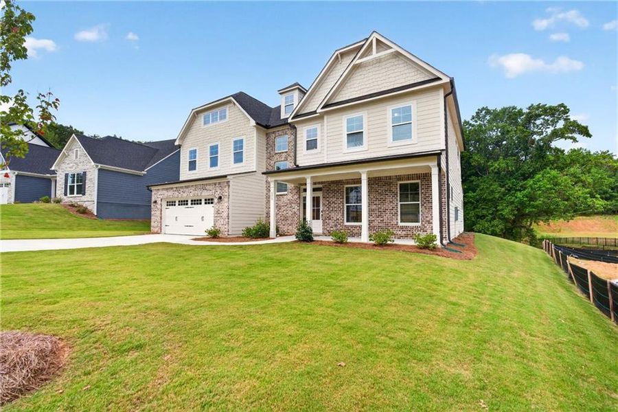 Front exterior of a new home in Arbor West, Dawsonville, GA, highlighting curb appeal (Image 27).