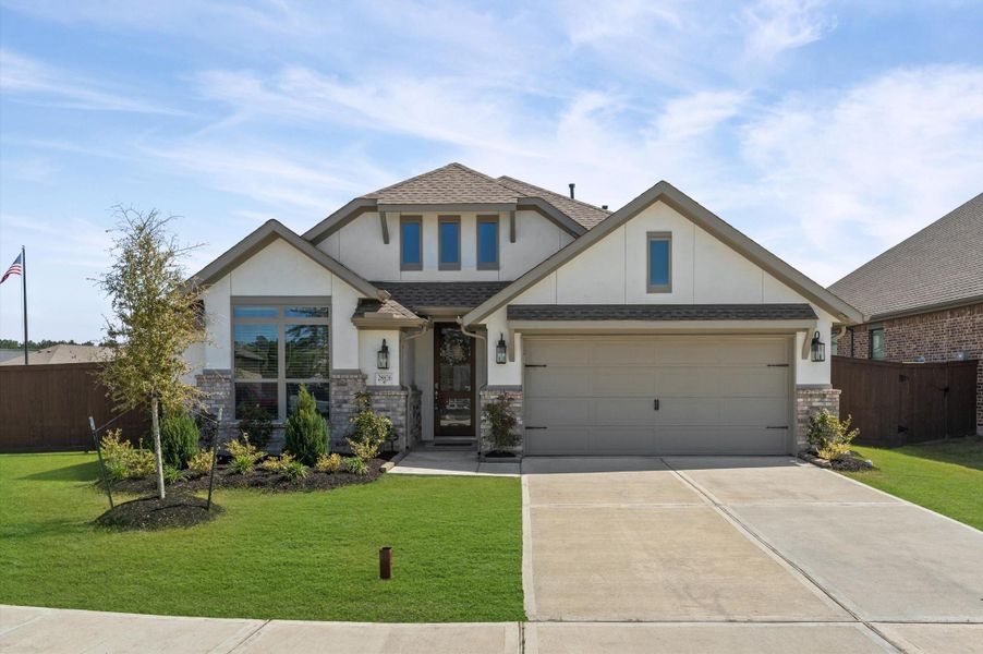 Front exterior of a new home in The Trails, New Caney, TX, highlighting curb appeal (Image 1). Front exterior of a new home in The Trails, New Caney, TX, highlighting curb appeal (Image 1).
