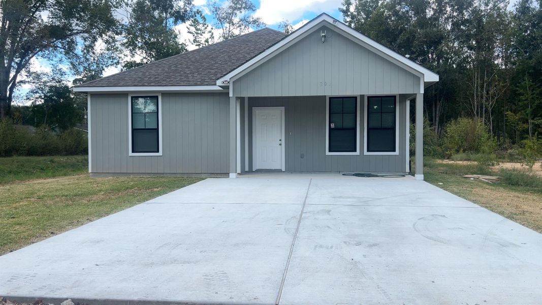 Front exterior of a new home in , Shepherd, TX, highlighting curb appeal (Image 13). Front exterior of a new home in , Shepherd, TX, highlighting curb appeal (Image 13).