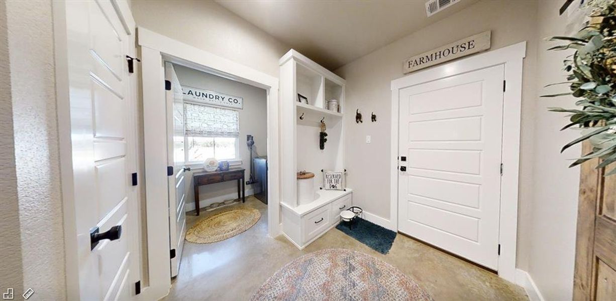 Mudroom featuring Laundry room entrance Mudroom featuring Laundry room entrance