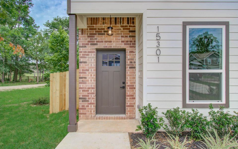 Exterior details and patio area of a home in Arrowhead Lakes, Willis (Image 28). Exterior details and patio area of a home in Arrowhead Lakes, Willis (Image 28).