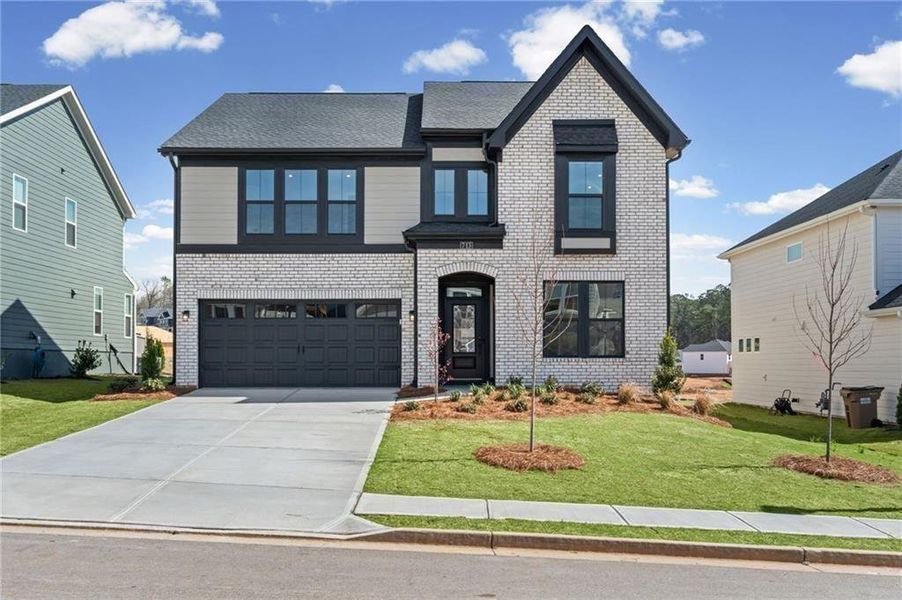 Front exterior of a new home in Twin Lakes, Hoschton, GA, highlighting curb appeal (Image 26). Front exterior of a new home in Twin Lakes, Hoschton, GA, highlighting curb appeal (Image 26).