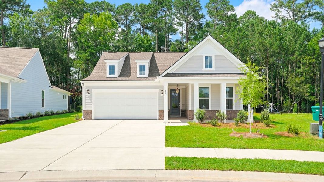 Front exterior of a new home in Midpoint at New Riverside, Bluffton, SC, highlighting curb appeal (Image 27). Front exterior of a new home in Midpoint at New Riverside, Bluffton, SC, highlighting curb appeal (Image 27).