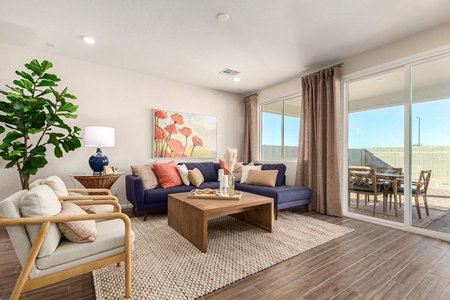 A living room with a large window. A living room with a large window.