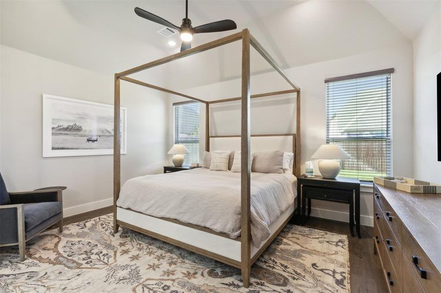 Primary Bedroom featuring light hardwood / wood-style flooring, ceiling fan, and lofted ceiling