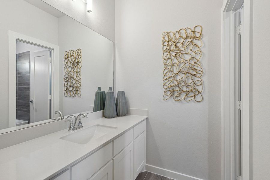 Bathroom in the Monet II home plan by Trophy Signature Homes – REPRESENTATIVE PHOTO