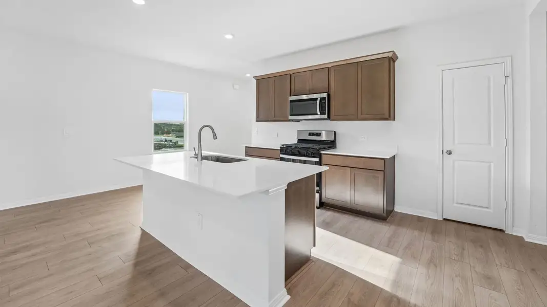 Furnished interior view inside a new home in Bar W Ranch, Leander (Image 8).