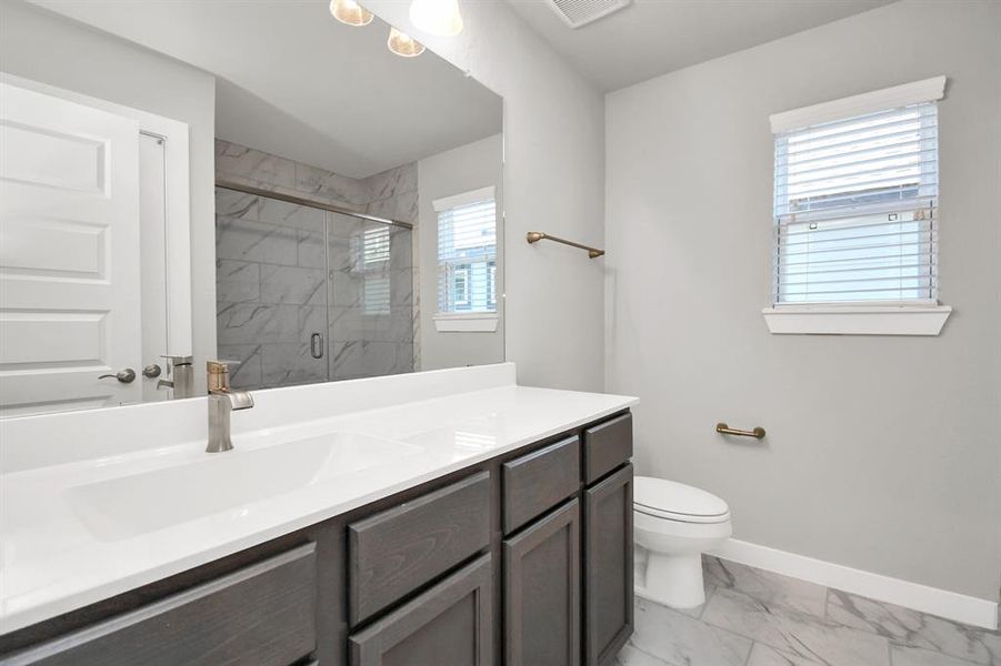 wood cabinets, beautiful light countertop. Sample photo of completed home with similar floor plan. Actual colors and selections may vary.