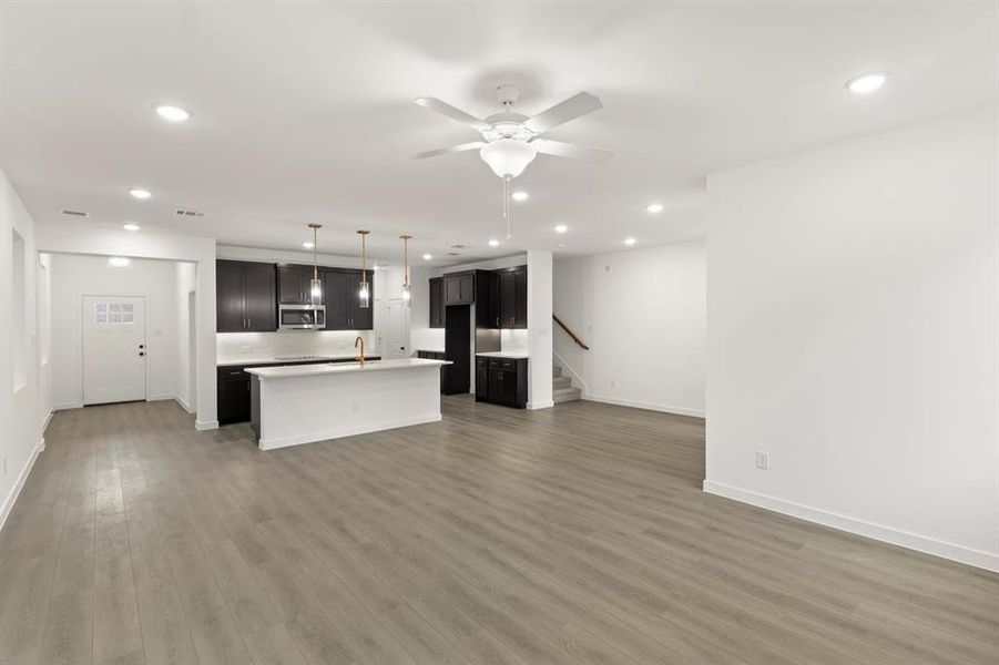 Open Kitchen-Living-Dining Room featuring the Oxford Collection