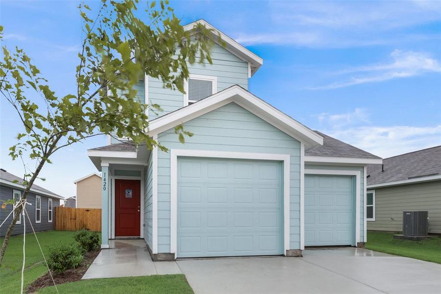 View of front of home featuring central AC and a front yard