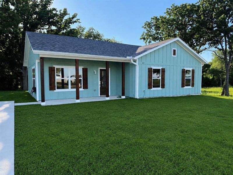 Light blue board and batten siding with white trim detailing Light blue board and batten siding with white trim detailing