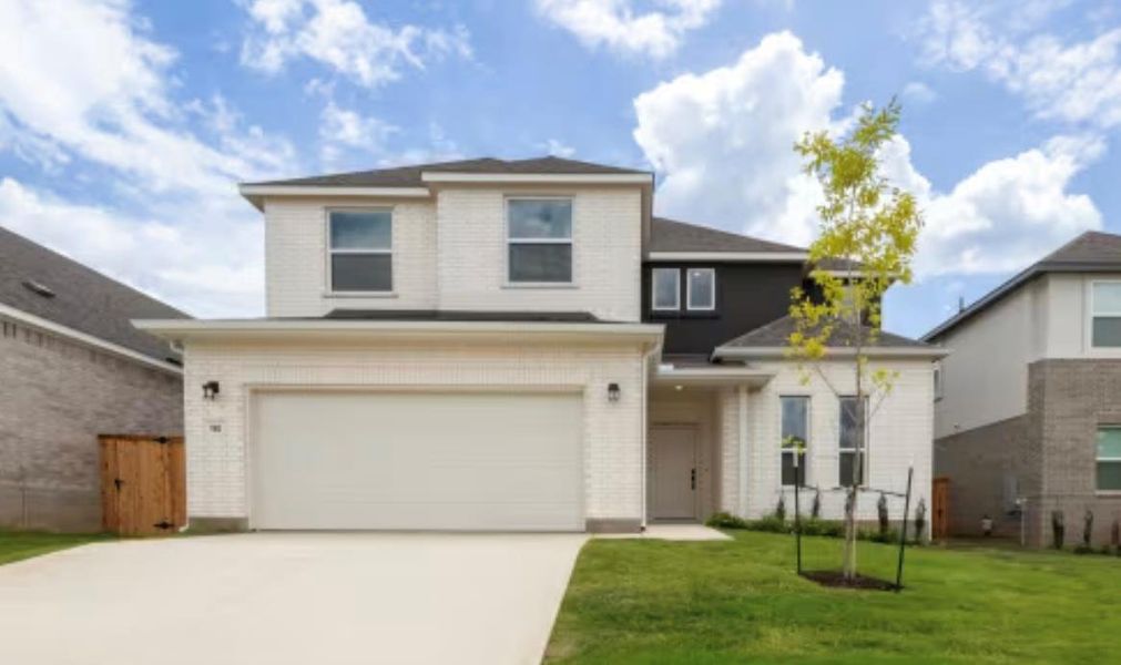 Front exterior of a new home in , Kyle, TX, highlighting curb appeal (Image 1). Front exterior of a new home in , Kyle, TX, highlighting curb appeal (Image 1).