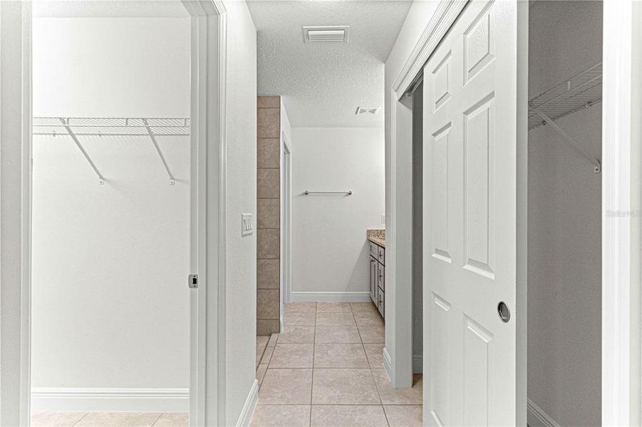 OWNERS SUITE BATHROOM WITH 1 LARGE WALK-IN CLOSET AND SECOND CLOSET