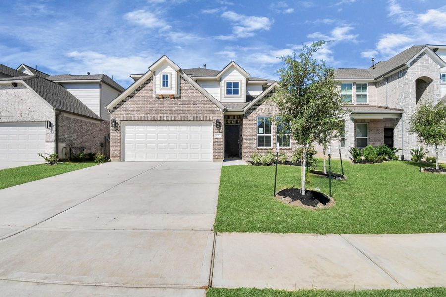 Front exterior of a new home in Telge Ranch, Cypress, TX, highlighting curb appeal (Image 20).