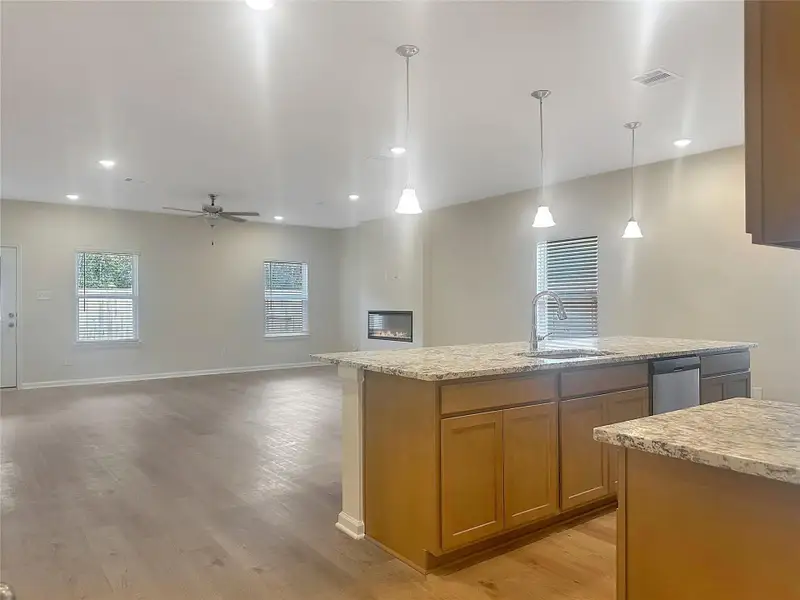 The Crawford- Kitchen and Family Room. Home is under construction, photos used for illustration only; actual features, colors, and upgrades may vary. The Crawford- Kitchen and Family Room. Home is under construction, photos used for illustration only; actual features, colors, and upgrades may vary.