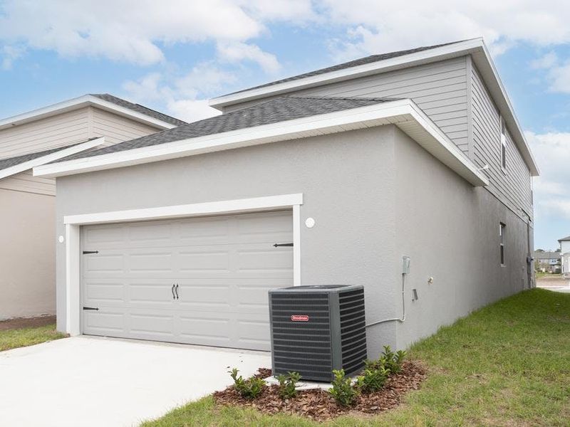 Attached 2-car garage located on the rear of the home with alley access - Capri home plan by Highland Homes Attached 2-car garage located on the rear of the home with alley access - Capri home plan by Highland Homes