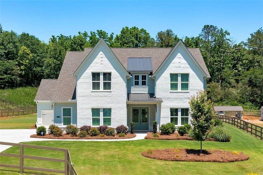 Front exterior of a new home in Maddux Path, Cumming, GA, highlighting curb appeal (Image 21). Front exterior of a new home in Maddux Path, Cumming, GA, highlighting curb appeal (Image 21).
