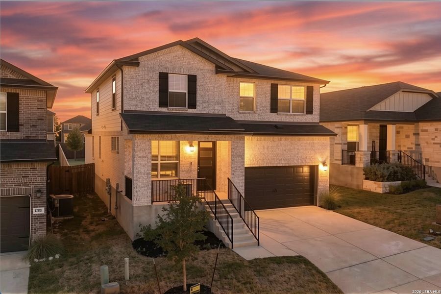 Front exterior of a new home in Thomas Pond, San Antonio, TX, highlighting curb appeal (Image 22).