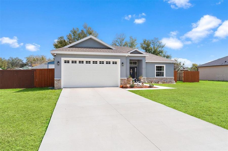 Front exterior of a new home in , Umatilla, FL, highlighting curb appeal (Image 26).