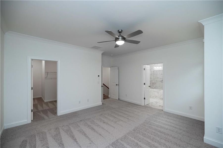 Owners bedroom and you can see the large walk in closet. Pictures represent a previously built home not the actual home, home is under construction.