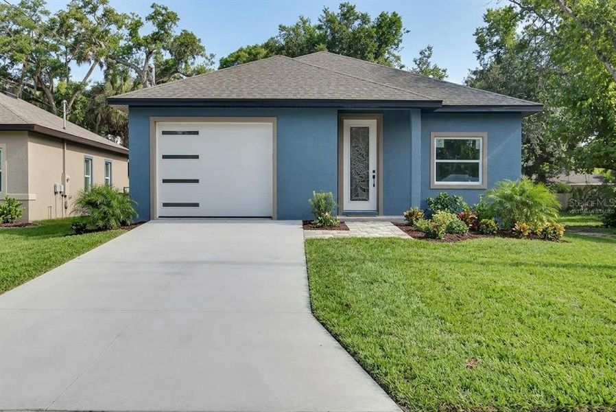 Front exterior of a new home in , Daytona Beach, FL, highlighting curb appeal (Image 1). Front exterior of a new home in , Daytona Beach, FL, highlighting curb appeal (Image 1).