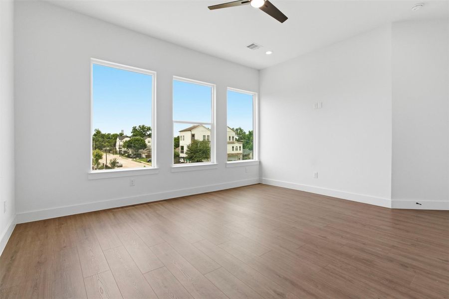 Spacious primary with large windows