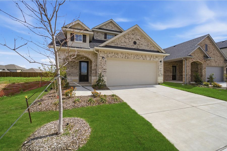 Front exterior of a new home in Westridge, McKinney, TX, highlighting curb appeal (Image 23). Front exterior of a new home in Westridge, McKinney, TX, highlighting curb appeal (Image 23).