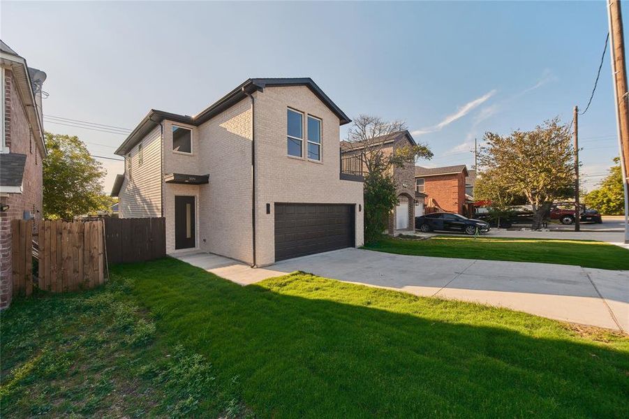 Modern home with a garage and a front lawn