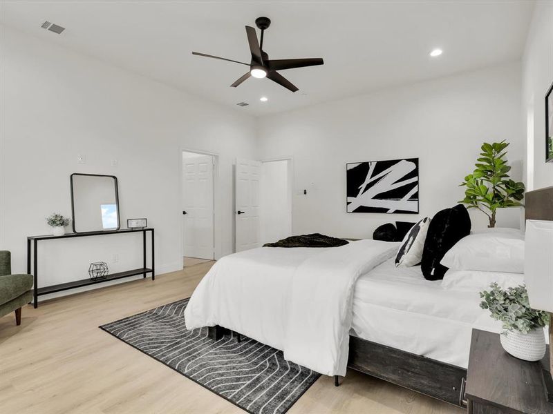 Bedroom with light hardwood / wood-style flooring and ceiling fan