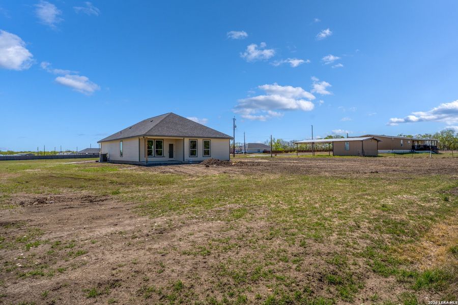Exterior details and patio area of a home in , Atascosa (Image 4).