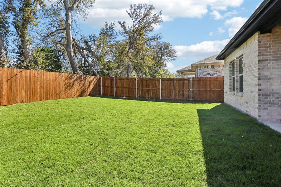 Exterior details and patio area of a home in Eastridge - Spring Series, McKinney (Image 19). Exterior details and patio area of a home in Eastridge - Spring Series, McKinney (Image 19).