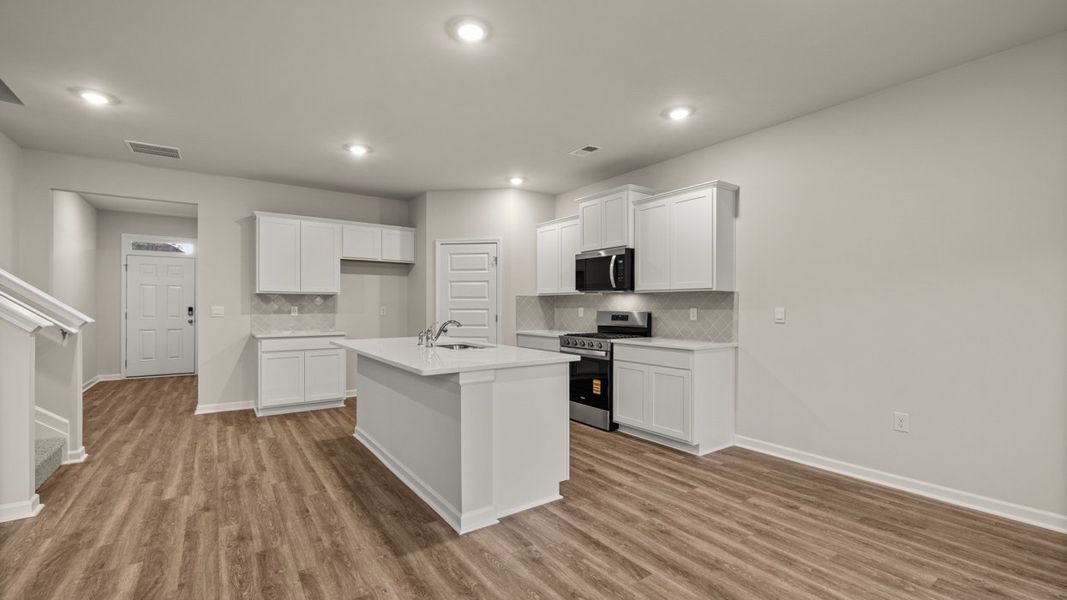 Representative furnished interior of a home built from the Hayden by D.R. Horton in Brooks Station, Dacula (Image 6).