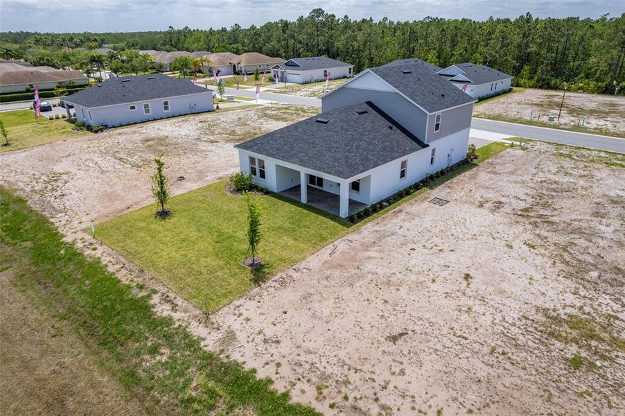 Front exterior of a new home in Gray Hawk at Hole Two, Daytona Beach, FL, highlighting curb appeal (Image 29). Front exterior of a new home in Gray Hawk at Hole Two, Daytona Beach, FL, highlighting curb appeal (Image 29).