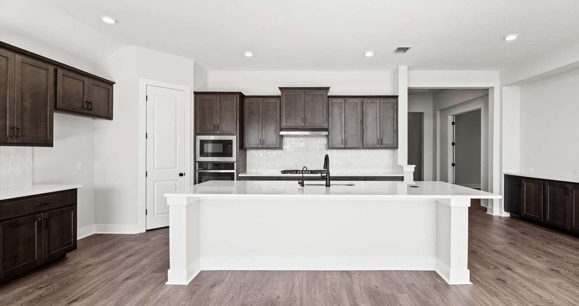 Furnished interior view inside a new home in 6 Creeks, Kyle (Image 6).