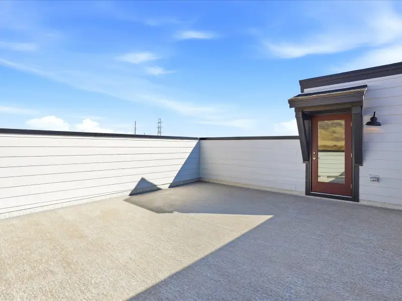 Exterior details and patio area of a home in Three Hills, Morrison (Image 18).