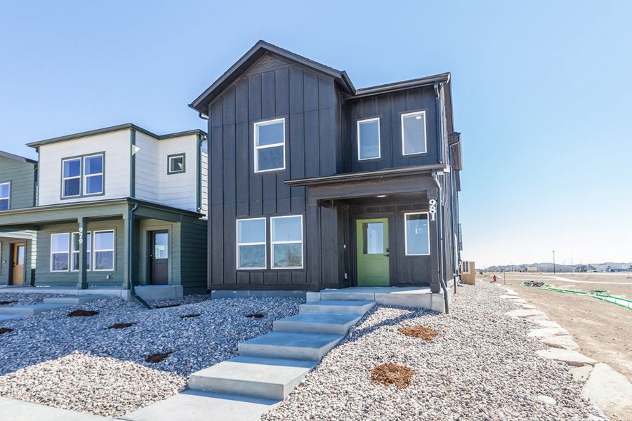 Front exterior of a new home in Prairie Song, Windsor, CO, highlighting curb appeal (Image 1). Front exterior of a new home in Prairie Song, Windsor, CO, highlighting curb appeal (Image 1).