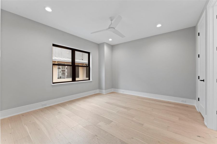 Bright 2nd bedroom with high ceilings and modern design comes with private bath and closet.