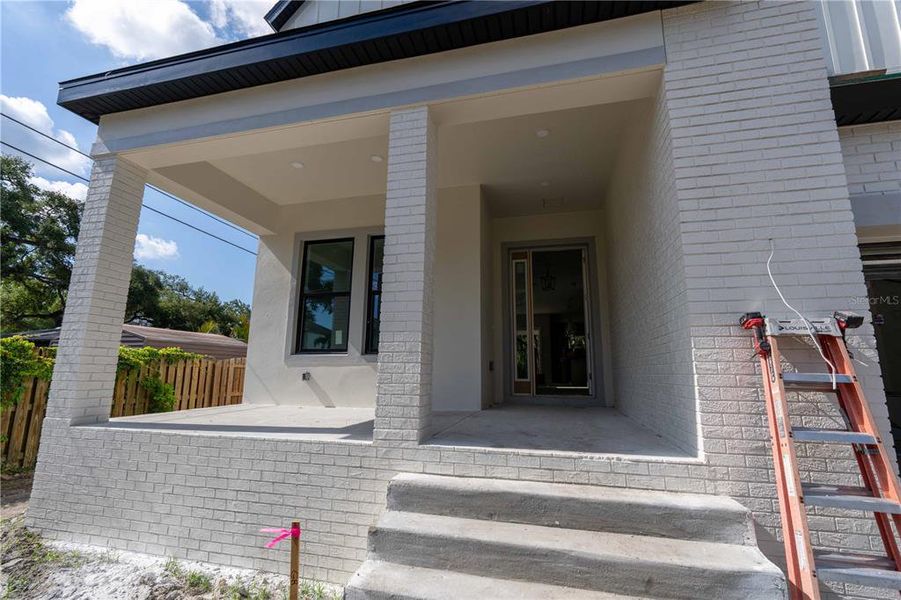 Exterior details and patio area of a home in City Homes - South Tampa, Tampa (Image 3).