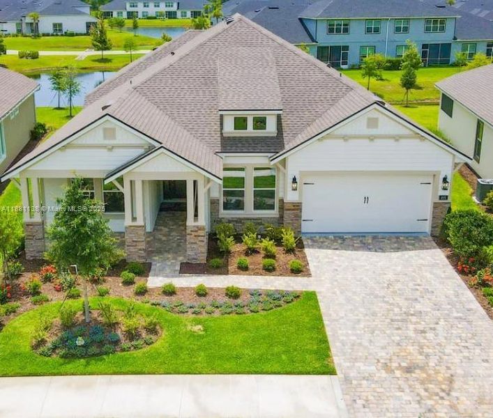 Front exterior of a new home in Westlake Single Family, Ormond Beach, FL, highlighting curb appeal (Image 1). Front exterior of a new home in Westlake Single Family, Ormond Beach, FL, highlighting curb appeal (Image 1).