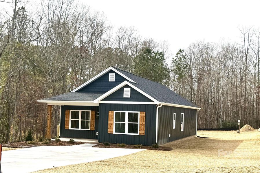 Front exterior of a new home in , Grover, NC, highlighting curb appeal (Image 1). Front exterior of a new home in , Grover, NC, highlighting curb appeal (Image 1).